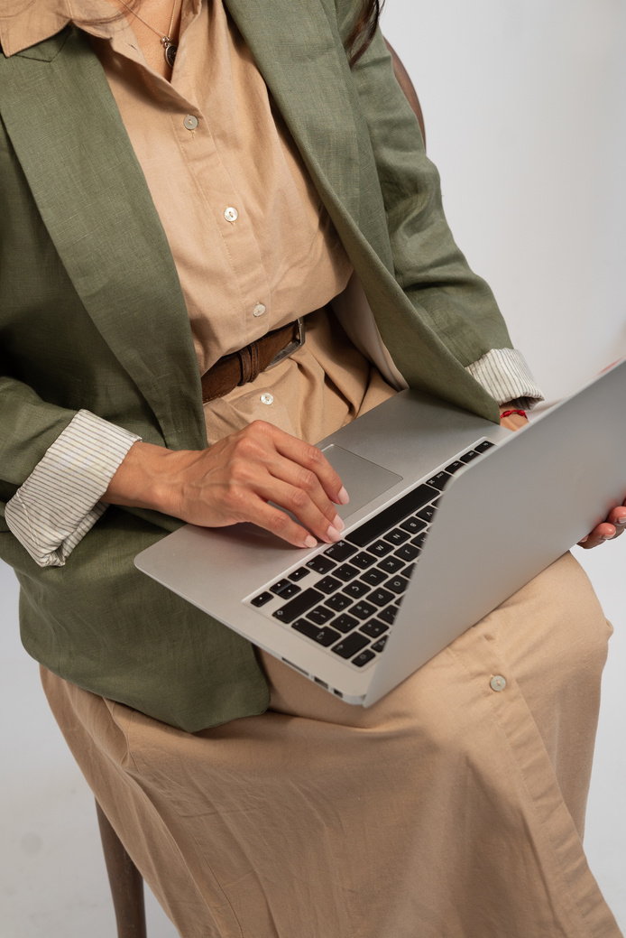 Woman Typing on a Laptop